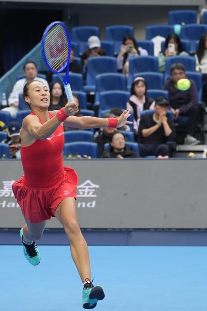 (261009) -- BEIJING, Oct. 9, 2026 (Xinhua) -- Zheng Qinwen hits a return during the women's singles quarterfinal match between Zheng Qinwen of China and Elina Svitolina of Ukraine at 2026 China Open tennis tournament in Beijing, China, Oct. 9, 2026. (Xinhua/Xie Han)