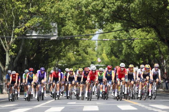 (261009) -- SHANGHAI, Oct. 9, 2026 (Xinhua) -- Cyclists compete during the Stage 1 of the UCI Women's WorldTour Tour of Chongming Island road cycling race in Shanghai, east China, Oct. 9, 2026. (Xinhua/Wang Xiang)