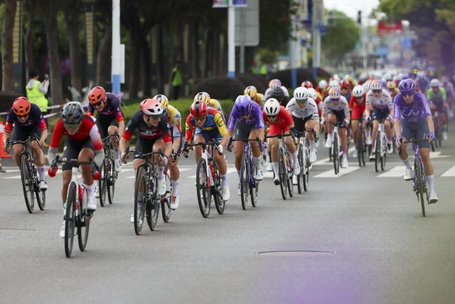 (261009) -- SHANGHAI, Oct. 9, 2026 (Xinhua) -- Cyclists compete during the Stage 1 of the UCI Women's WorldTour Tour of Chongming Island road cycling race in Shanghai, east China, Oct. 9, 2026. (Xinhua/Wang Xiang)