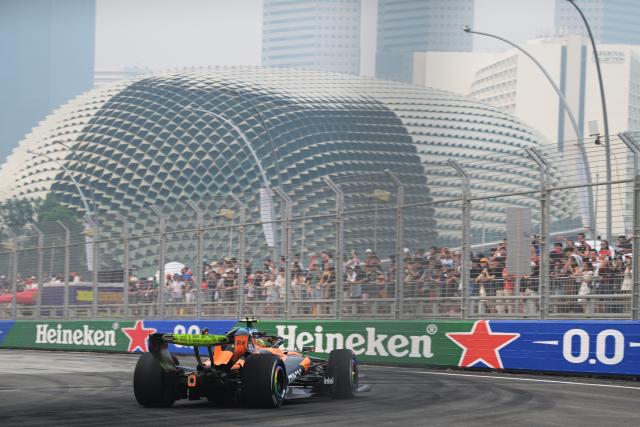 (261009) -- SINGAPORE, Oct. 9, 2026 (Xinhua) -- McLaren's Lando Norris of Britain drives during the practice session of the Formula One Singapore Grand Prix at the Marina Bay Street Circuit in Singapore, Oct. 9, 2026. (Photo by Then Chih Wey/Xinhua)