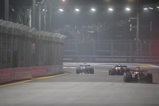 (261009) -- SINGAPORE, Oct. 9, 2026 (Xinhua) -- Cadillac's Mexican driver Sergio Perez (L) is seen driving after crashing during sprint qualifying for the Formula One Singapore Grand Prix at the Marina Bay Street Circuit on Oct. 9, 2026. (Photo by Then Chih Wey/Xinhua)