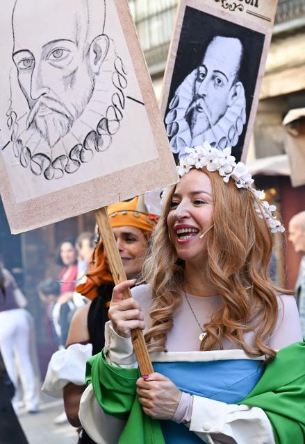 (261009) -- ALCALA DE HENARES, Oct. 9, 2026 (Xinhua) -- People holding portraits of Miguel de Cervantes participate in the parade during the Cervantes Week celebration in Alcala de Henares, Spain, Oct. 9, 2026. Cervantes Week is being celebrated from Oct. 8 to 12 in Alcala de Henares, the hometown of Spanish writer Miguel de Cervantes. The annual festival honors Cervantes, one of Spain's greatest literary figures. (Xinhua/Cheng Min)