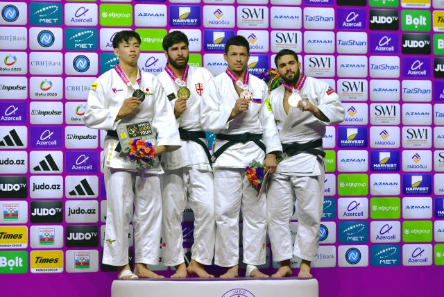 (261010) -- BAKU, Oct. 10, 2026 (Xinhua) -- (L to R) Silver medalist Arai Dota of Japan, gold medalist Ilia Sulamanidze of Georgia, bronze medalists Niiaz Bilalov of Russia and Gennaro Pirelli of Itlay pose on the podium for the men's -100kg event at the 2026 World Senior Judo Championships in Baku, Azerbaijan, Oct. 9, 2026. (Xinhua/Chen Junfeng)