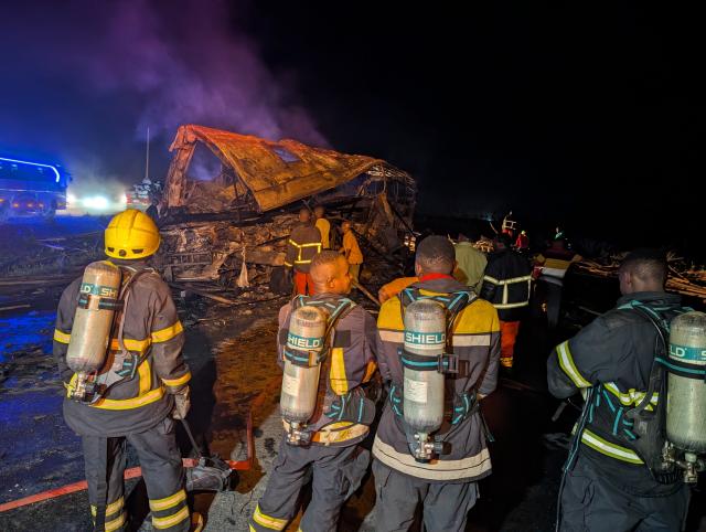 (261010) -- BEIJING, Oct. 10, 2026 (Xinhua) -- Firefighters work at the site of a head-on collision between a bus and a truck in Mkambarani, Morogoro Region, eastern Tanzania, Oct. 9, 2026. At least 28 people were killed in a head-on collision between a passenger bus and a truck in Tanzania's eastern Morogoro Region, the regional fire and rescue service said Friday.
   Joseph Mwasabeja, acting commander of the Morogoro Regional Fire and Rescue Force, said the accident occurred overnight Thursday at Mkambarani along the Morogoro-Dar es Salaam highway. (Xinhua)