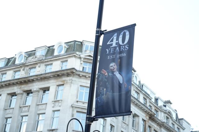 (261010) -- LONDON, Oct. 10, 2026 (Xinhua) -- This photo taken on Oct. 9, 2026 shows a banner for the 40th anniversary of the musical "The Phantom of the Opera" in London, Britain. TO GO WITH "Feature: 40 'phantastic' years: 'The Phantom of the Opera' highlights enduring appeal of London's West End" (Xinhua/Zhao Jiasong)