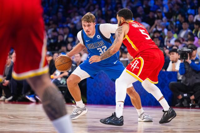 (261010) -- MACAO, Oct. 10, 2026 (Xinhua) -- Cooper Flagg (L) of Dallas Mavericks competes during the 2026-2027 NBA preseason game between Houston Rockets and Dallas Mavericks in Macao, south China, Oct. 9, 2026. (Xinhua/Cheong Kam Ka)
