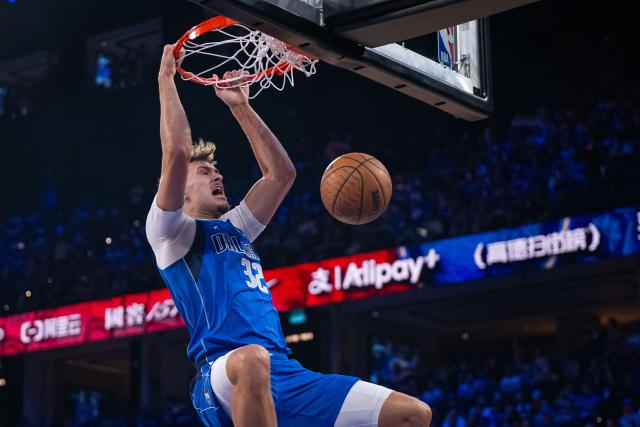 (261010) -- MACAO, Oct. 10, 2026 (Xinhua) -- Cooper Flagg of Dallas Mavericks dunks during the 2026-2027 NBA preseason game between Houston Rockets and Dallas Mavericks in Macao, south China, Oct. 9, 2026. (Xinhua/Cheong Kam Ka)