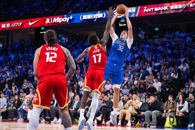 (261010) -- MACAO, Oct. 10, 2026 (Xinhua) -- Cooper Flagg (R) of Dallas Mavericks shoots during the 2026-2027 NBA preseason game between Houston Rockets and Dallas Mavericks in Macao, south China, Oct. 9, 2026. (Xinhua/Cheong Kam Ka)
