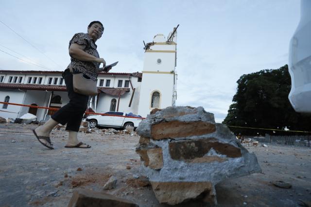 (261010) -- PANAMA CITY, Oct. 10, 2026 (Xinhua) -- A woman walks near a collapsed bell tower of a church after a strong earthquake in Penonome, central Cocle Province of Panama. A powerful earthquake and a series of strong aftershocks rattled Panama on Friday, sending residents into the streets, disrupting water supplies and briefly halting flights as the government mobilized emergency personnel and resources.
  The University of Panama's Institute of Geosciences measured the initial quake at magnitude 7.2. It struck at 12:56 p.m. local time (1756 GMT) at a depth of 4 kilometers. By 5:30 p.m. local time, more than 40 earthquakes had been recorded, including over a dozen with magnitudes above 5.0. A quake at 3:25 p.m. had a magnitude of 6.9. (Photo by Daniel Gonzalez/Xinhua)