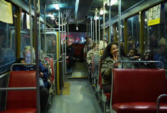 (261010) -- COPENHAGEN, Oct. 10, 2026 (Xinhua) -- Visitors enjoy a ride on a vintage bus during Culture Night 2026 in Copenhagen, Denmark, Oct. 9, 2026. Copenhagen's annual Culture Night, launched in 1993, took place here on Friday night. Museums, libraries and public institutions opened their doors, offering visitors tours, performances and family activities across Copenhagen. (Photo by Liu Zhichao/Xinhua)