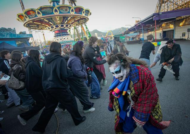 (261010) -- VANCOUVER, Oct. 10, 2026 (Xinhua) -- People attend the Fright Nights 2026 at the Pacific National Exhibition's Playland in Vancouver, British Columbia, Canada, Oct. 9, 2026. The annual Halloween-themed event is held here from Oct. 7 to Oct. 31. (Photo by Liang Sen/Xinhua)