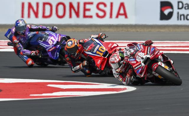 (261010) -- LOMBOK, Oct. 10, 2026 (Xinhua) -- Ducati Lenovo Team's Francesco Bagnaia (front R) of Italy races during the qualifying 2 at the Pertamina Grand Prix of Indonesia 2026 at Mandalika International circuit in Lombok, Indonesia, Oct. 10, 2026. (Xinhua/Zulkarnain)