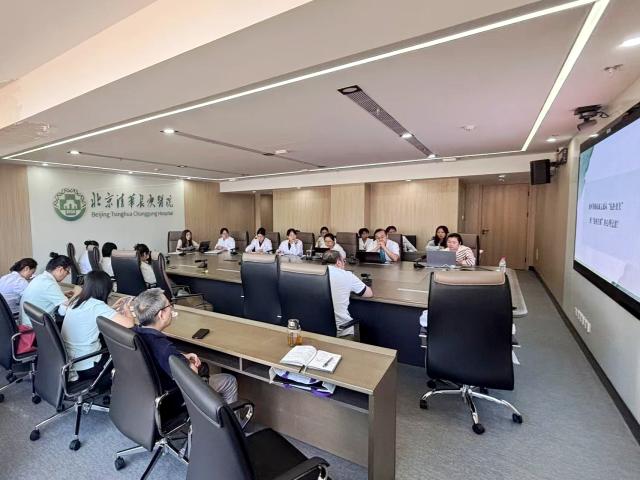 (261010) -- BEIJING, Oct. 10, 2026 (Xinhua) -- Lu Guijun and his hospice team carry out the hospice care grand rounds at a conference room of Beijing Tsinghua Changgung Hospital in Beijing, China, Sept. 21, 2026. TO GO WITH "Feature: The ferryman of life for eternal peace" (Xinhua)