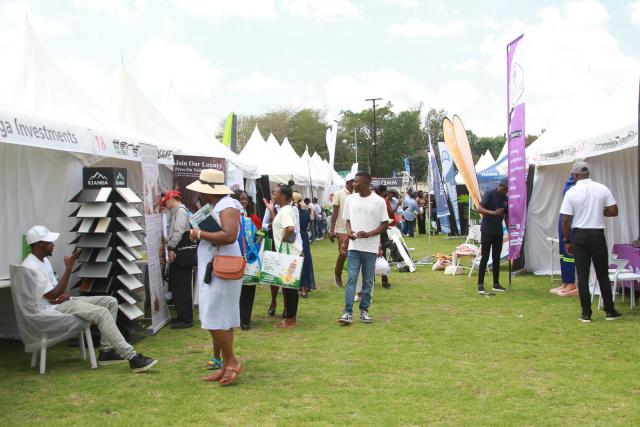 (261010) -- HARARE, Oct. 10, 2026 (Xinhua) -- People attend the China-Zimbabwe Commodity Expo and Job Fair in Harare, Zimbabwe, on Oct. 9, 2026. TO GO WITH "Feature: Young Zimbabweans explore employment opportunities with Chinese firms at job fair" (Photo by Tafara Mugwara/Xinhua)