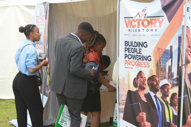 (261010) -- HARARE, Oct. 10, 2026 (Xinhua) -- People attend the China-Zimbabwe Commodity Expo and Job Fair in Harare, Zimbabwe, on Oct. 9, 2026. TO GO WITH "Feature: Young Zimbabweans explore employment opportunities with Chinese firms at job fair" (Photo by Tafara Mugwara/Xinhua)