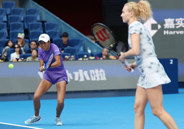 (261010) -- BEIJING, Oct. 10, 2026 (Xinhua) -- Katerina Siniakova/Zhang Shuai (L) compete during the women's doubles semifinal match between Katerina Siniakova (the Czech Republic)/Zhang Shuai (China) and Erin Routliffe (New Zealand)/Aldila Sutjiadi (Indonesia) at 2026 China Open tennis tournament in Beijing, China, Oct. 10, 2026. (Xinhua/Zhang Chenlin)