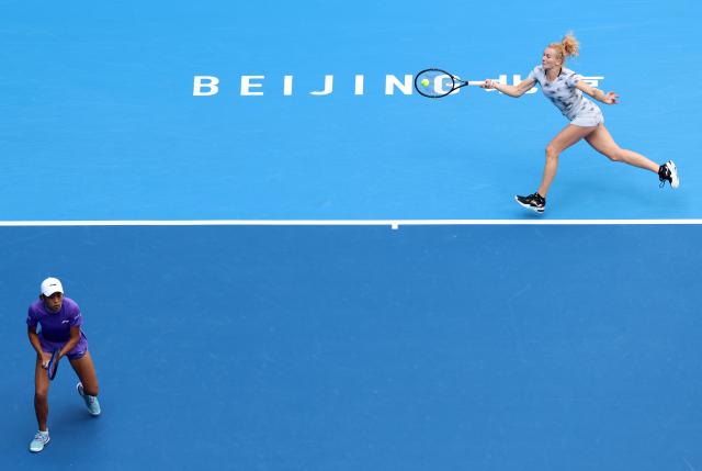 (261010) -- BEIJING, Oct. 10, 2026 (Xinhua) -- Katerina Siniakova (R)/Zhang Shuai compete during the women's doubles semifinal match between Katerina Siniakova (the Czech Republic)/Zhang Shuai (China) and Erin Routliffe (New Zealand)/Aldila Sutjiadi (Indonesia) at 2026 China Open tennis tournament in Beijing, China, Oct. 10, 2026. (Xinhua/Zhang Chenlin)