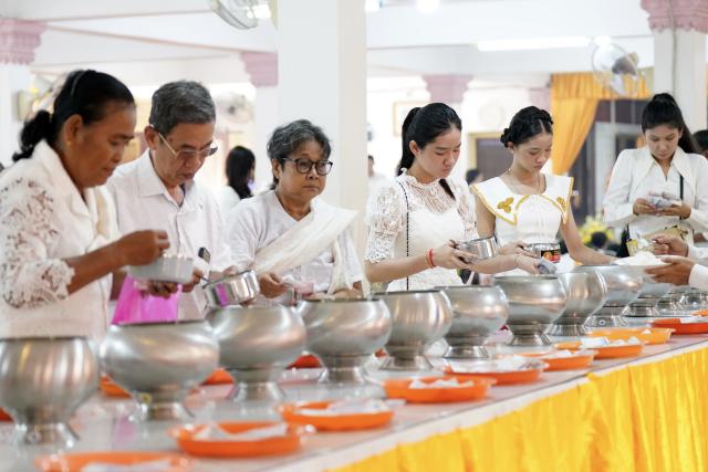 (261010) -- PHNOM PENH, Oct. 10, 2026 (Xinhua) -- People offer steamed rice to honor their ancestors during the Pchum Ben festival in Phnom Penh, Cambodia, Oct. 10, 2026. Cambodia on Saturday started to observe its traditional three-day Pchum Ben holiday, also known as Ancestor's Day, running from Oct. 10 to 12. (Photo by Sovannara/Xinhua)