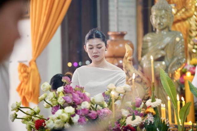 (261010) -- PHNOM PENH, Oct. 10, 2026 (Xinhua) -- A woman prepares offerings during the Pchum Ben festival in Phnom Penh, Cambodia, Oct. 10, 2026. Cambodia on Saturday started to observe its traditional three-day Pchum Ben holiday, also known as Ancestor's Day, running from Oct. 10 to 12. (Photo by Sovannara/Xinhua)