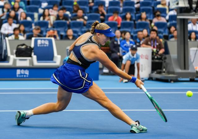 (261010) -- BEIJING, Oct. 10, 2026 (Xinhua) -- Mirra Andreeva of Russia hits a return during the women's singles semifinal match against Nikola Bartunkova of the Czech Republic at 2026 China Open tennis tournament in Beijing, China, Oct. 10, 2026. (Xinhua/Sun Fei)