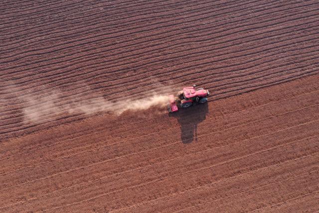 (261010) -- BEIJING, Oct. 10, 2026 (Xinhua) -- An aerial drone photo taken on Oct. 10, 2026 shows farm machinery working in the fields ahead of wheat sowing at Shiyuan Village in Qinyang City, central China's Henan Province. As autumn sets in, farmers across China make the most of the farming season to work to ensure stable grain production. (Photo by Yang Fan/Xinhua)
