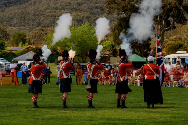 (261010) -- CANBERRA, Oct. 10, 2026 (Xinhua) -- A ceremonial guard dressed in traditional Scottish attire performs a musket-firing display during the Canberra Highland Gathering in Canberra, Australia, on Oct. 10, 2026. The Scottish cultural event featuring traditional sports, bagpipe and drum performances, dance and traditional food was held in Canberra on Saturday. (Photo by Chu Chen/Xinhua)