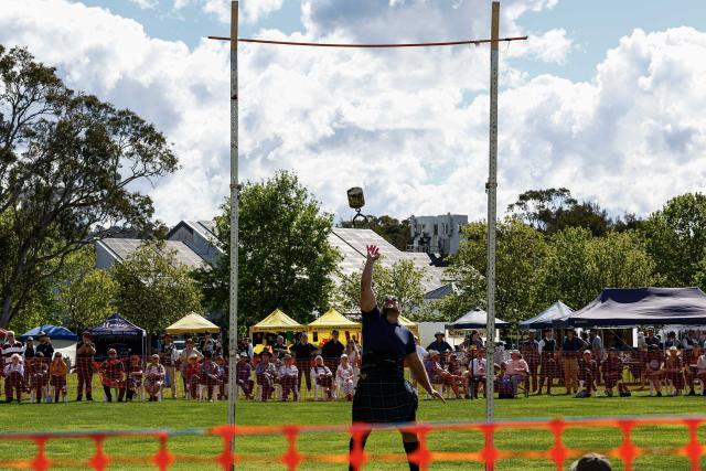 (261010) -- CANBERRA, Oct. 10, 2026 (Xinhua) -- A competitor takes part in the weight-over-bar competition during the Canberra Highland Gathering in Canberra, Australia, on Oct. 10, 2026. The Scottish cultural event featuring traditional sports, bagpipe and drum performances, dance and traditional food was held in Canberra on Saturday. (Photo by Chu Chen/Xinhua)