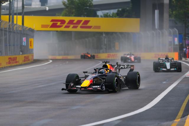 (261010) -- SINGAPORE, Oct. 10, 2026 (Xinhua) -- Red Bull's Max Verstappen (front) of the Netherlands leads the race during the sprint of the Formula One Singapore Grand Prix at the Marina Bay Street Circuit, on Oct. 10, 2026. (Photo by Qian Jun/Xinhua)