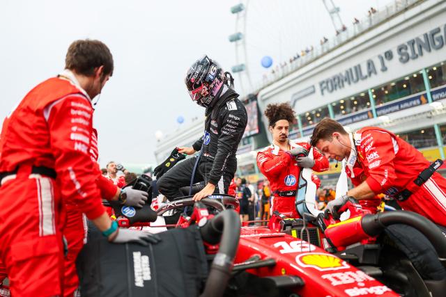(261010) -- SINGAPORE, Oct. 10, 2026 (Xinhua) -- Ferrari's Charles Leclerc (2nd L) of Monaco prepares on the grid before the sprint of the Formula One Singapore Grand Prix at the Marina Bay Street Circuit, on Oct. 10, 2026. (Photo by Qian Jun/Xinhua)