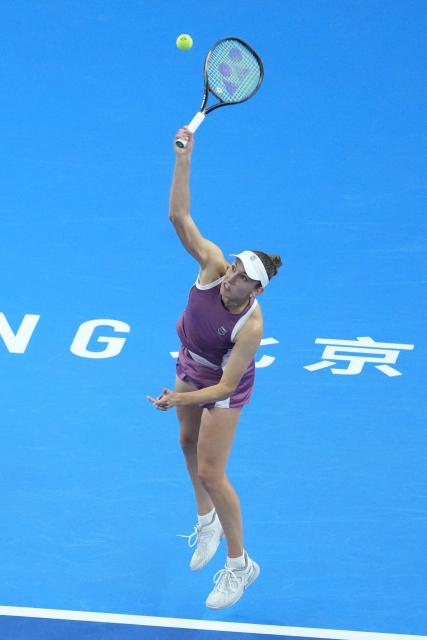 (261010) -- BEIJING, Oct. 10, 2026 (Xinhua) -- Elise Mertens serves during the women's singles semifinal between Zheng Qinwen of China and Elise Mertens of Belgium at 2026 China Open tennis tournament in Beijing, China, Oct. 10, 2026. (Xinhua/Ju Huanzong)