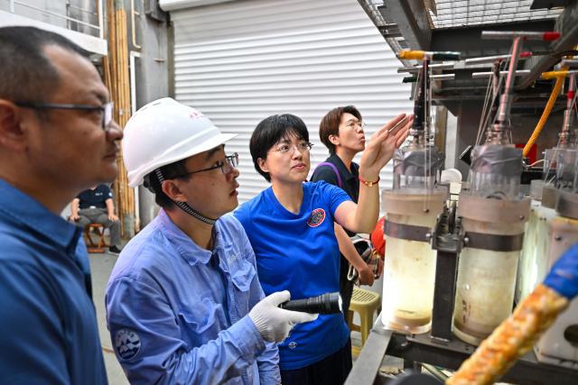 (261010) -- ABOARD RESEARCH VESSEL DEEP SEA NO. 1, Oct. 10, 2026 (Xinhua) -- Submersible pilot Zhang Yi (2nd R) talks with members of the manned deep-sea submersible Jiaolong support team aboard the research vessel Deep Sea No. 1 in the western Pacific Ocean, on Oct. 10, 2026. China's research vessel Deep Sea No. 1, carrying manned deep-sea submersible Jiaolong, arrived at East Caroline Basin in the western Pacific Ocean on Saturday for deep-sea scientific research.
   This marks the 466th dive of Jiaolong, with a planned diving depth of about 4,500 meters. (Xinhua/Ye Haoming)