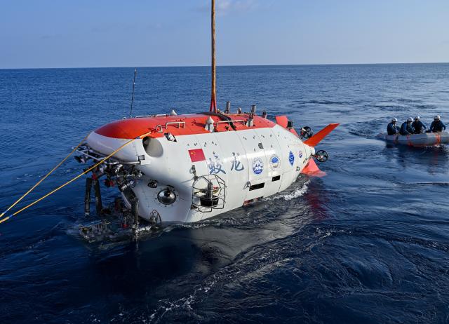 (261010) -- ABOARD RESEARCH VESSEL DEEP SEA NO. 1, Oct. 10, 2026 (Xinhua) -- The manned deep-sea submersible Jiaolong is pictured before its dive in the western Pacific Ocean, on Oct. 10, 2026. China's research vessel Deep Sea No. 1, carrying manned deep-sea submersible Jiaolong, arrived at East Caroline Basin in the western Pacific Ocean on Saturday for deep-sea scientific research.
   This marks the 466th dive of Jiaolong, with a planned diving depth of about 4,500 meters. (Xinhua/Li Xin)