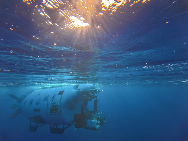 (261010) -- ABOARD RESEARCH VESSEL DEEP SEA NO. 1, Oct. 10, 2026 (Xinhua) -- China's manned deep-sea submersible Jiaolong prepares to dive after safety inspection in the western Pacific Ocean, Oct. 10, 2026. China's research vessel Deep Sea No. 1, carrying manned deep-sea submersible Jiaolong, arrived at East Caroline Basin in the western Pacific Ocean on Saturday for deep-sea scientific research.
   This marks the 466th dive of Jiaolong, with a planned diving depth of about 4,500 meters. (Xinhua/Li Xin)
