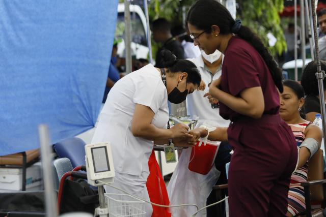 (261010) -- PENONOME, Oct. 10, 2026 (Xinhua) -- Patients receive treatment at a temporary shelter after being evacuated from a damaged hospital in Penonome, Panama, Oct. 10, 2026. Panama declared a state of emergency on Saturday to coordinate relief efforts and assist communities affected by a powerful earthquake that struck the country Friday. (Photo by Daniel Gonzalez/Xinhua)