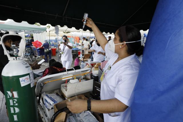 (261010) -- PENONOME, Oct. 10, 2026 (Xinhua) -- Patients receive treatment at a temporary shelter after being evacuated from a damaged hospital in Penonome, Panama, Oct. 10, 2026. Panama declared a state of emergency on Saturday to coordinate relief efforts and assist communities affected by a powerful earthquake that struck the country Friday. (Photo by Daniel Gonzalez/Xinhua)