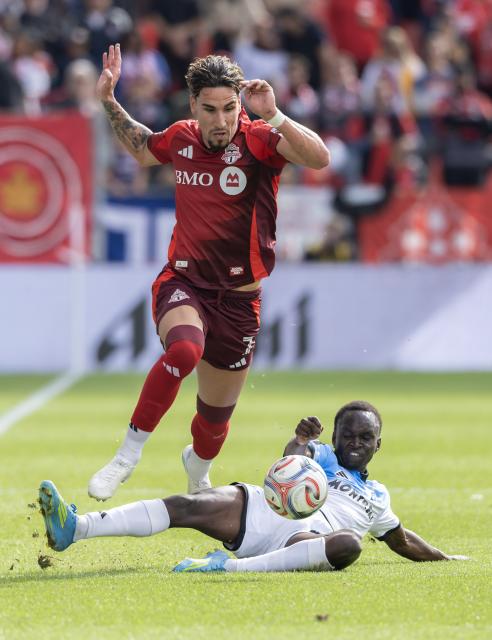 (261011) -- TORONTO, Oct. 11, 2026 (Xinhua) -- Theo Corbeanu (L) of Toronto FC vies with Victor Loturi of CF Montreal during the 2026 Major League Soccer (MLS) regular season match between Toronto FC and CF Montreal at BMO Field in Toronto, Canada, on Oct. 10, 2026. (Photo by Zou Zheng/Xinhua)