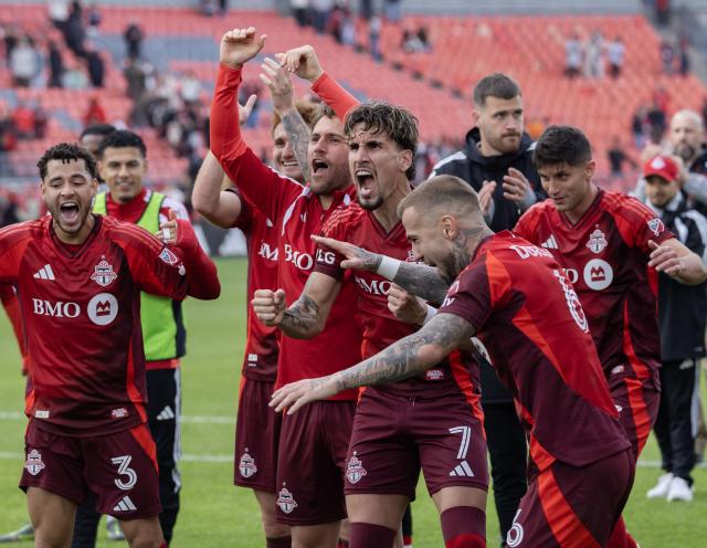 (261011) -- TORONTO, Oct. 11, 2026 (Xinhua) -- Players of Toronto FC celebrate victory after the 2026 Major League Soccer (MLS) regular season match between Toronto FC and CF Montreal at BMO Field in Toronto, Canada, on Oct. 10, 2026. (Photo by Zou Zheng/Xinhua)
