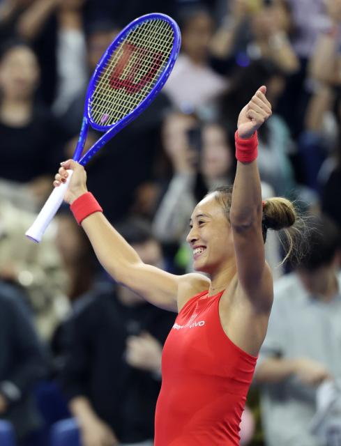 (261011) -- BEIJING, Oct. 11, 2026 (Xinhua) -- Zheng Qinwen celebrates after the women's singles semifinal between Zheng Qinwen of China and Elise Mertens of Belgium at 2026 China Open tennis tournament in Beijing, China, Oct. 10, 2026. (Xinhua/Zhang Chenlin)