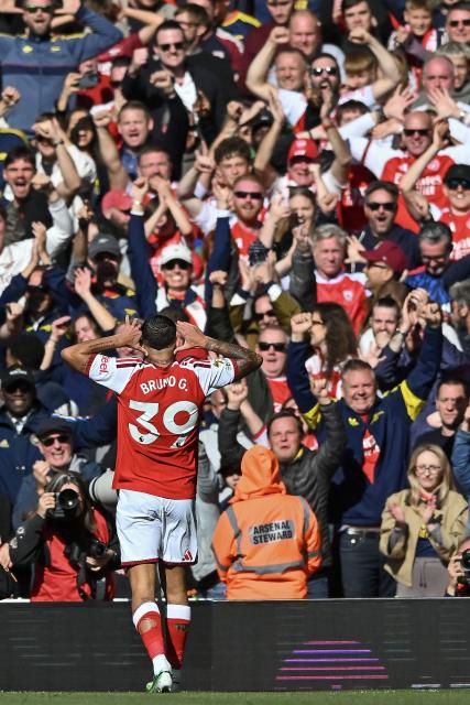(261011) -- LONDON, Oct. 11, 2026 (Xinhua) -- Bruno Guimaraes of Arsenal celebrates scoring the winning goal during the English Premier League match between Arsenal and Leeds United in London, Britain, on Oct. 10, 2026. (Xinhua)