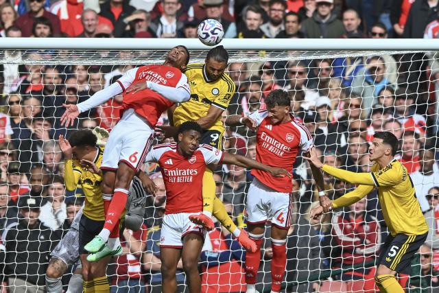 (261011) -- LONDON, Oct. 11, 2026 (Xinhua) -- Gabriel Magalhaes (top L) of Arsenal vies with Dominic Calvert-Lewin (top R) of Leeds United during the English Premier League match between Arsenal and Leeds United in London, Britain, on Oct. 10, 2026. (Xinhua)