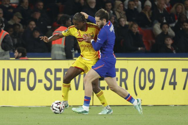 (261011) -- PARIS, Oct. 11, 2026 (Xinhua) -- Paris Saint-Germain's Khvicha Kvaratskhelia (R) vies with Le Mans' Rayan Bamba during the Ligue 1 football match between Paris Saint-Germain and Le Mans in Paris, France, Oct. 10, 2026. (Photo by Henri Szwarc/Xinhua)