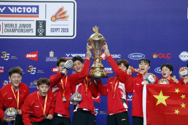 (261011) -- CAIRO, Oct. 11, 2026 (Xinhua) -- Team China poses on the podium during the award ceremony after winning the final against Malaysia at the BWF World Junior Team Championships 2026 in Cairo, Egypt, Oct. 10, 2026. (Xinhua/Ahmed Gomaa)