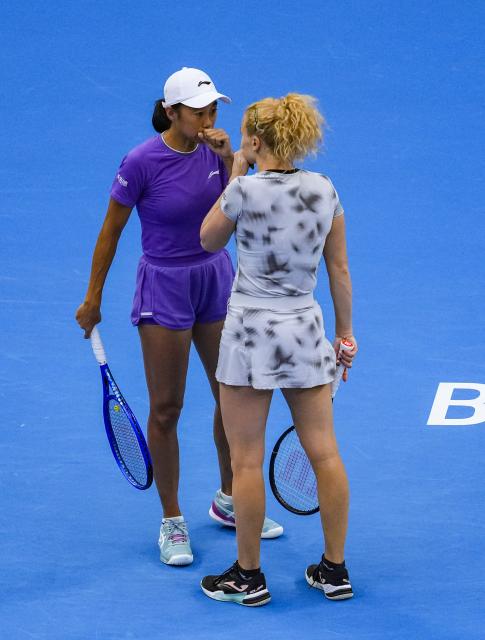 (261011) -- BEIJING, Oct. 11, 2026 (Xinhua) -- Katerina Siniakova (the Czech Republic)/Zhang Shuai (L, China) communicate during the women's doubles final against Gabriela Dabrowski (Canada)/Luisa Stefani (Brazil) at 2026 China Open tennis tournament in Beijing, China, Oct. 11, 2026. (Xinhua/Sun Fei)