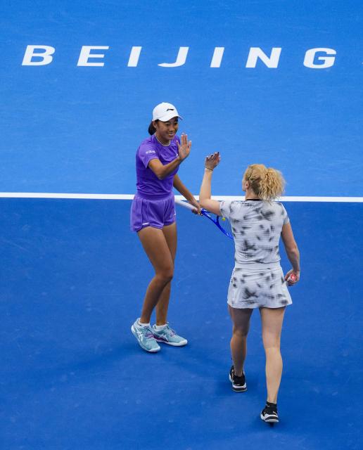 (261011) -- BEIJING, Oct. 11, 2026 (Xinhua) -- Katerina Siniakova (the Czech Republic)/Zhang Shuai (L, China) celebrate scoring during the women's doubles final against Gabriela Dabrowski (Canada)/Luisa Stefani (Brazil) at 2026 China Open tennis tournament in Beijing, China, Oct. 11, 2026. (Xinhua/Sun Fei)