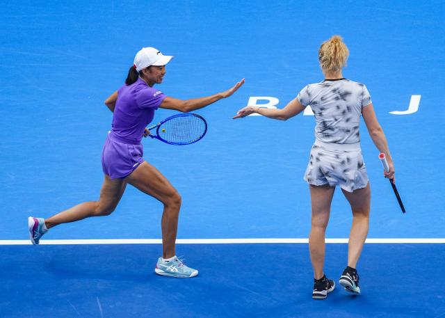 (261011) -- BEIJING, Oct. 11, 2026 (Xinhua) -- Katerina Siniakova (the Czech Republic)/Zhang Shuai (L, China) celebrate during the women's doubles final against Gabriela Dabrowski (Canada)/Luisa Stefani (Brazil) at 2026 China Open tennis tournament in Beijing, China, Oct. 11, 2026. (Xinhua/Sun Fei)