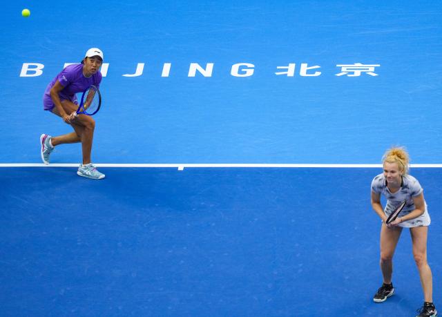 (261011) -- BEIJING, Oct. 11, 2026 (Xinhua) -- Katerina Siniakova (the Czech Republic)/Zhang Shuai (L, China) compete during the women's doubles final against Gabriela Dabrowski (Canada)/Luisa Stefani (Brazil) at 2026 China Open tennis tournament in Beijing, China, Oct. 11, 2026. (Xinhua/Sun Fei)