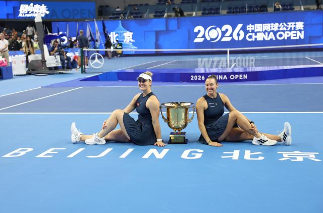 (261011) -- BEIJING, Oct. 11, 2026 (Xinhua) -- Winner Gabriela Dabrowski (L) of Canada/Luisa Stefani of Brazil pose after the awarding ceremony for the women's doubles at 2026 China Open tennis tournament in Beijing, China, Oct. 11, 2026. (Xinhua/Zhang Chenlin)