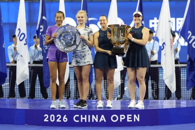 (261011) -- BEIJING, Oct. 11, 2026 (Xinhua) -- Winner Gabriela Dabrowski (1st R) of Canada/Luisa Stefani of Brazil pose with runner-up Katerina Siniakova (2nd L) of the Czech Republic/Zhang Shuai (1st L) of China during the awarding ceremony for the women's doubles at 2026 China Open tennis tournament in Beijing, China, Oct. 11, 2026. (Xinhua/Zhang Chenlin)