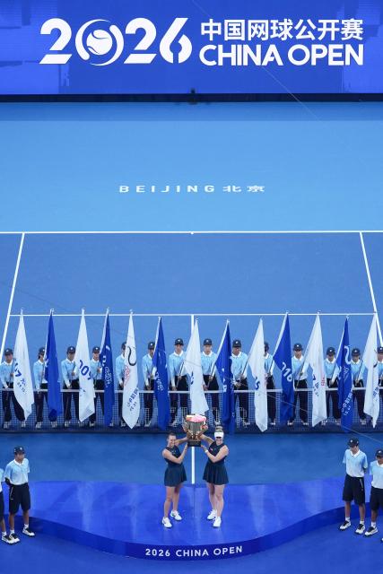 (261011) -- BEIJING, Oct. 11, 2026 (Xinhua) -- Winner Gabriela Dabrowski (3rd R, front) of Canada/Luisa Stefani (2nd L, front) of Brazil pose during the awarding ceremony for the women's doubles at 2026 China Open tennis tournament in Beijing, China, Oct. 11, 2026. (Xinhua/Ju Huanzong)