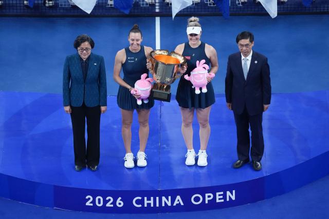 (261011) -- BEIJING, Oct. 11, 2026 (Xinhua) -- Winner Gabriela Dabrowski (2nd R) of Canada/Luisa Stefani (2nd L) of Brazil pose during the awarding ceremony for the women's doubles at 2026 China Open tennis tournament in Beijing, China, Oct. 11, 2026. (Xinhua/Ju Huanzong)